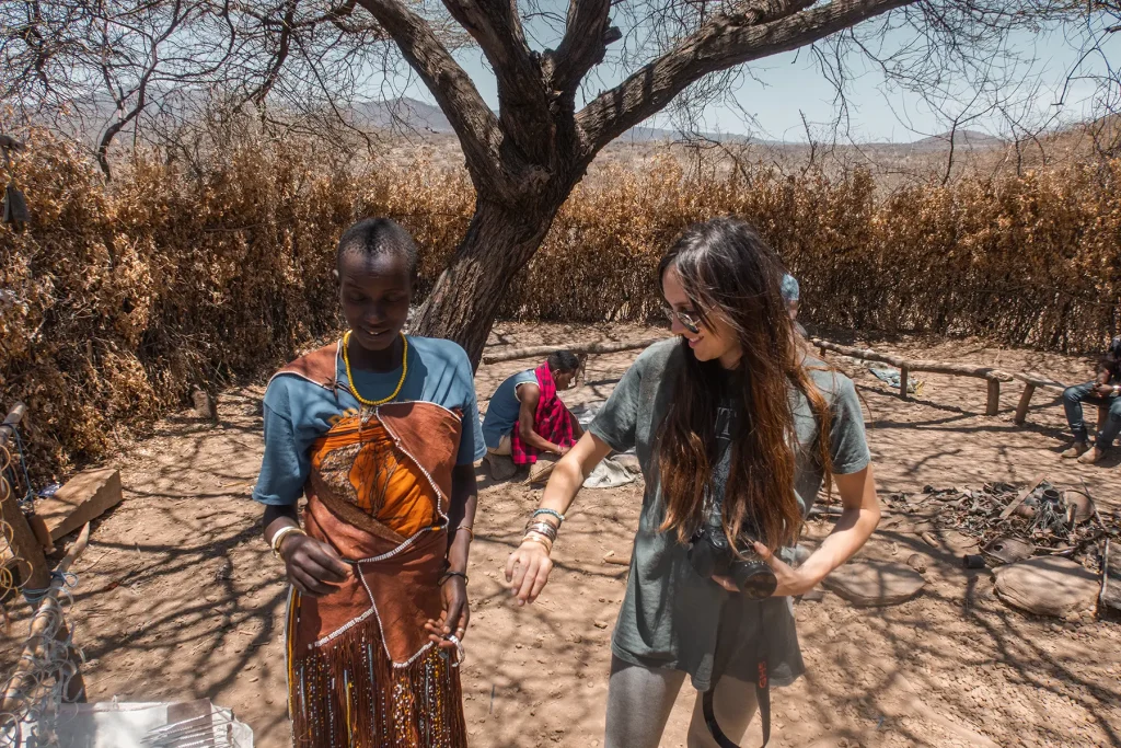 Ella McKendrick trying on a bracelet made by the Datoga tribe in Lake Eyasi, Tanzania